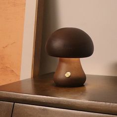 a brown mushroom sitting on top of a wooden dresser