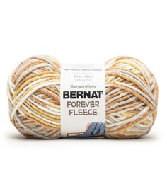 bernat forever fleece yarn in beige, yellow and white colors on a white background