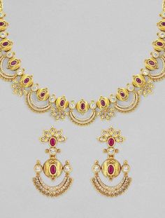 Gold Ruby Necklace With Intricate Design, Traditional Gold Ruby Necklaces, Ruby Necklace With Intricate Design For Celebration, Wedding Dual-tone 22k Gold Necklace, Ornate Dual-tone Jewelry For Wedding, Dual-tone 22k Gold Necklace For Weddings, Elegant Dual-tone Chandbali Necklace, Gold Temple Necklace With Intricate Ruby Design, Gold Ruby Jeweled Necklaces