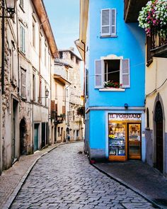 an image of a street with buildings on it