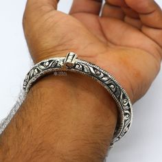 Handcrafted 925 sterling silver fabulous bangle bracelet kada . fabulous attractive lion face work silver bracelet kada jewelry , excellent wedding or party jewelry/gifting jewelry from India. Metal-925 sterling silver. Type-Bangle/bracelet/kada. Width-11mm. Inner diameter-5.6 centimeter.(Easily wearable by twisting it) size-2-4(2.25")or 2-6 (2.375") select your size. Weight-89 to 92.500 grams approx. Stamped-925. Finish-Oxidized. Makes excellent gifting and collectable pieces. Heavy Silver Bangle Jewelry, Oxidized Festival Bracelet Jewelry, Silver Ceremonial Bangle Jewelry, Silver Jewelry With Unique Design For Ceremonial Occasions, Sterling Silver Bangle With Intricate Design For Festivals, Sterling Silver Intricate Bangle For Festivals, Unique Silver Bracelet For Festivals, Silver 925 Stamped Bangle Jewelry, Unique Silver Bracelets For Festivals