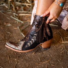 Introducing KALIOPE - WOMEN'S, the perfect combination of style and function. This boot features laser cut outs, python print, and fringe detailing, as well as braiding and gold studs for added flair. Make a statement and stand out from the crowd with these neat and eye-catching boots. Bailey Core, Wedding Cowboy Boots, Fringe Cowboy Boots, Boho Shoes, Boho Boots, Witch Fashion, Python Print, Baby Cowboy, Cowgirl Style