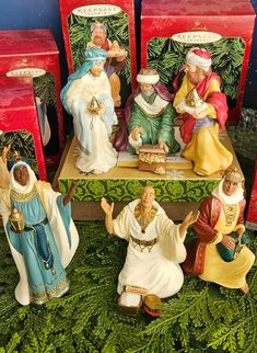 the nativity scene includes figurines of jesus, mary and joseph