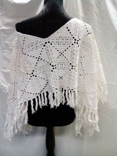 Bridal white crochet lace capelet,recycled, women,handmade, shawl,poncho,cotton. This is upcycled.It is made from an old tablecloth. Sometimes I'm in fantasy mood, so I made it:) It is one of my favorite . It's unique, handmade with love, only one, only for you. Size free Thanks for your interest in my shop. Hope you find something made for you:) https://www.endladisain.ee White Bohemian Poncho With Fringe, White Bohemian Poncho Shawl, White One Size Crochet Top, White Handmade Bohemian Poncho, White One Size Bohemian Poncho, White Handmade Bohemian Crochet Top, White Vintage Crochet Top For Festivals, Lace Capelet, Wedding Shrug