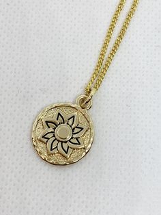 Adorn your neckline with this tasteful flower pendant necklace. Available in two gleaming hues, it'll look divine paired with our Lotus Flower Charm Bracelet! Engraved Flower Shape Necklaces, Gold Necklace With Flower Charm, Gold Pendant Necklace With Flower Charm, Gold Charm Necklace With Flower Charm, Gold Flower Jewelry With Delicate Chain, Gold Pendant Flower Necklace With Flower Charm, Gold Flower Charm Pendant Necklace, Gold Flower Shaped Jewelry With Delicate Chain, Gold Birth Flower Pendant Necklace