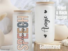 two personalized tumblers sitting next to each other on a wooden table with mushrooms