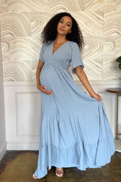 Bobby is boho chic at her best, with her wide neckline & bellowing multi-paneled hem. This gown is perfect for a Bohemian-themed shower. or photoshoot, and can be worn again and again throughout pregnancy and after baby arrives. The Bobby Maxi Dress is a lightweight cotton with a soft stretchy waistband for you and your baby’s comfort. Available in 3 colours: Misty Rose, Light Steel Blue, Off White Summer Tiered Maternity Dress, Tiered Maternity Dress For Summer, Tiered Summer Maternity Dress, Spring Floor-length Maternity Dress, Modest Flowy Maxi Dress With Empire Waist, Modest Maternity Dress With Short Sleeves, Spring Maternity Wear Tiered Dress, Spring Maternity Tiered Dress, Flowy Bohemian Dress With Empire Waist