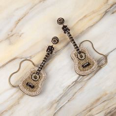 Give your look a touch of melody with our Guitar Earrings Guitar Earrings, Deepa Gurnani, Handmade Guitar, Steel Post, Mild Steel, Metallic Thread, Handmade Fashion, Conversation Piece, Metal Chain