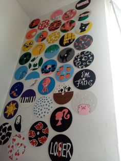 the wall is covered with many different types of stickers