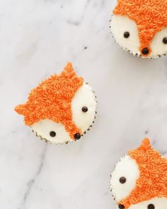 two cupcakes decorated like foxes on top of a marble counter with the words instagram