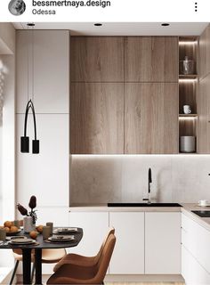 an image of a modern kitchen setting with white and wood accents on the cabinets, counter tops, and dining room table