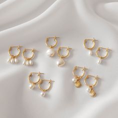 Sweet and dainty, these gold huggie earrings feature a dangling pearl charm of your choice. These are all made of 14K gold filled materials and are tarnish-resistant, water-resistant, and hypoallergenic. Hoop measures 9, 12, or 15mm in diameter, depending on your choice. Pearls are all genuine freshwater pearls. Gift box included with purchase. --------------------♥ PROMOS ♥-------------------- Want 10% off? Join the mailing list by visiting http://bit.ly/vedern . Just leave me a note at checkou Charm Earrings Hoop, Hoop Earrings Pearl, Gold Hoop Pearl Earrings, Gold Huggie Pearl Earrings, Gold Dangle Earrings, Fantasy Earrings, Vintage Jewelry Necklace, Freshwater Pearl Jewelry, Snake Earrings