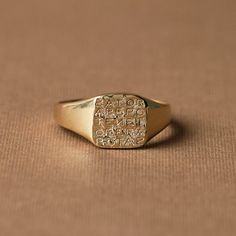 The Magic Sator Square Signet Ring is a testament to the mysterious intersection of language, numbers, and power. This unique piece of jewelry takes its inspiration from the enigmatic SATOR Square, a word puzzle first unearthed in the archaeological remnants of Pompeii, which dates back to at least 79CE. Celebrated British classical historian Donald Atkinson described the square as dwelling in the "mysterious region where religion, superstition, and magic meet, where words, numbers, and letters Ceremonial 14k Gold Signet Ring With Polished Finish, 14k Gold Ceremonial Signet Ring With Polished Finish, Classic 14k Gold Engraved Ring For Ceremonial Occasions, Spiritual 14k Gold Tarnish Resistant Rings, Spiritual Engraved 14k Gold Ring, Symbolic Formal Jewelry With Etched Details, Spiritual 14k Gold Engraved Ring, Formal Symbolic Etched Jewelry, Ceremonial 14k Gold Engraved Ring With Polished Finish