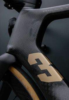 the front brake of a bicycle with gold and black decals on it's side