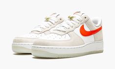 The Women’s Nike Air Force 1 Low SE “First Use” shows respect to the brand’s iconic Swoosh logo with unique, vintage-inspired branding.  A June 2021 release by Nike, this women’s edition of the former basketball shoe references the famous Nike logo with special “First Use June 18, 1971” text below a white outline Swoosh on both sides.  More “1971” detailing also appears on the insoles and a decidedly retro orange “Nike” logo is embroidered onto the heel.  A classic “Nike” insignia with an orange Shoe References, Womens Air Force 1, Air Force 1 High, Cute Nikes, Nike Air Force 1 Low, Stadium Goods, Retro Sneakers, Nike Womens, Orange Leather