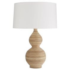 a wooden table lamp with a white shade