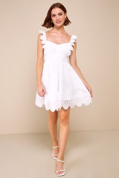 The Lulus Sincerely Precious White Eyelet Embroidered Ruffled Mini Dress was made for frolicking in the sunshine! Lightweight woven cotton, with summery eyelet embroidery throughout, shapes a flattering sweetheart neckline and a gathered bodice, framed by ruffled, elasticized straps. Pleated accents create a high, banded waist that sits atop a tiered skater skirt that finishes at a scalloped mini hem. Smocking at back for fit and hidden zipper/clasp at side. Fit: This garment fits true to size. Ruffled Mini Dress, Gathered Bodice, Eyelet Embroidery, Womens Fashion Casual Summer, Fashion Dresses Casual, White Eyelet, Summer Style Casual, Woven Cotton, Women's Summer Fashion