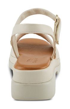 A subtle platform and chunky heel elevate a rich leather sandal grounded by a well-cushioned footbed for all-day comfort. 2" heel; 1" platform Adjustable ankle strap with hook-and-loop closure Memory foam cushioning Leather upper and lining/synthetic sole Made in Turkey Cream Leather Sandals With Arch Support, Leather Low Heel Wedge Sandals With Arch Support, Leather Wedge Sandals With Arch Support And Low Heel, Low Heel Leather Wedge Sandals With Arch Support, Cream Leather Wedge Sandals With Cushioned Footbed, White Leather Wedge Sandals With Arch Support, Cream Leather Sandals With Low Heel, Cream Open Toe Sandals With Arch Support, Cream Leather Wedge Sandals With Round Toe