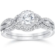 a white gold engagement ring set with an oval diamond center and twisted shants on the band