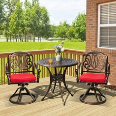 two chairs and a table on a deck