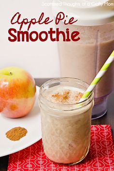 an apple pie smoothie in a mason jar with two straws on the side