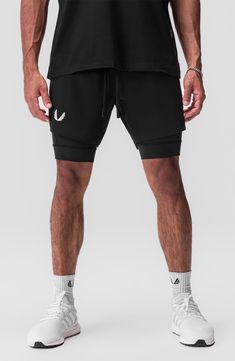 Lightweight, stretchy and ready to conquer the elements, these water- and odor-repellent shorts sport an interior compression layer for supportive comfort. They come with multiple bounce-resistant pockets for holding your keys, cash, phone and energy gels as you run or work out. 6" inseam; 24" leg opening; 11 1/2" front rise; 15" back rise (size Medium) Interior compression shorts Polygiene® antimicrobial fabric engineered to inhibit the growth of odor-causing germs TETRA-LITE fabric offers lots Breathable 4-way Stretch Sports Bottoms, Compressive Breathable Bottoms For Sportswear, Compressive Sportswear Bottoms With Breathable Fabric, High Stretch Sports Bottoms, Functional High Stretch Sports Bottoms, Compressive Moisture-wicking Sportswear Bottoms, Black Bottoms With Built-in Shorts For Running, Breathable 4-way Stretch Sportswear Bottoms, Functional Black Bottoms With Built-in Shorts