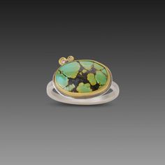 This lovely ring features a smooth, oval, green turquoise, veined with delicate, intriguing inclusion patterns. The stone is wrapped in warm 22k gold and accented with a pair of sparkling diamonds set in 22k gold. Sterling silver back and 2mm hammered band. Setting measures approximately 3/8 inch x 5/8 inch. Matte finish. Gold Turquoise Multi-stone Oval Ring, Gold Oval Turquoise Multi-stone Ring, Gold Oval Multi-stone Turquoise Ring, Unique Yellow Gold Oval Turquoise Ring, Elegant Green Turquoise Ring, Yellow Gold Turquoise Ring With Gemstone Accents, Yellow Gold Oval Turquoise Ring With Gemstone Accents, Hammered Band, Lovely Ring