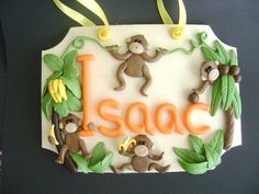 a cake decorated with monkeys and the word i - saac