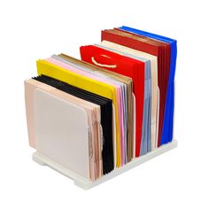 a stack of folders sitting on top of each other in front of a white background