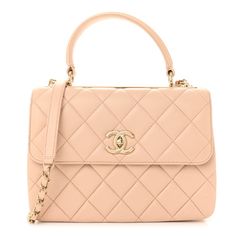 This is an authentic CHANEL Lambskin Quilted Small Trendy CC Dual Handle Flap Bag in Beige.This stylish handbag is crafted of diamond quilted lambskin leather. The refined bag features a reinforced leather top handle with a gold bar with Chanel logo and gold links, a gold chain leather threaded shoulder strap with a shoulder pad, and a gold Chanel CC logo on the front flap. This opens to a partitioned matching beige leather interior with zipper and patch pockets. Top Handle Shoulder Bag With Cc Turnlock Closure, Flap Bag With Cc Turnlock Closure For Shopping, Top Handle Flap Bag With Cc Turnlock For Shopping, Shopping Flap Bag With Cc Turnlock And Top Handle, Luxury Satchel With Cc Turnlock Closure, Luxury Quilted Flap Bag, High-end Quilted Shoulder Bag For Formal Occasions, Leather Satchel With Cc Turnlock Closure And Double Handle, Luxury Satchel With Cc Turnlock Closure And Double Handle