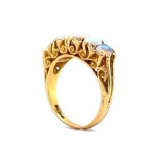 This antique Victorian era ring boasts an antique feel that will transport you to a time of glamour and luxury. Crafted from 18 karat yellow gold, this ring features beautiful cabochon opals as the primary stones and are set across the entirety of the band. The opals are complemented by eight diamonds, adding a hint of sparkle. Its timeless beauty and exceptional quality make it the perfect addition to any jewelry collection. Whether you're looking for a statement piece for a special occasion or Heirloom Yellow Gold Moonstone Cabochon Ring, Classic Yellow Gold Moonstone Cabochon Ring, Classic Yellow Gold Cabochon Moonstone Ring, Heirloom Gold Opal Cabochon Ring, Heirloom Gold Opal Ring With Cabochon, Anniversary Yellow Gold Opal Cabochon Ring, Heirloom Yellow Gold Opal Ring Collectible, Heirloom Yellow Gold Oval Cabochon Opal Ring, Vintage Gold Opal Cabochon Ring