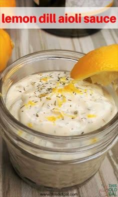 lemon dill aioli sauce in a glass jar with an orange peel on top