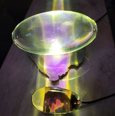 a glass bowl sitting on top of a table