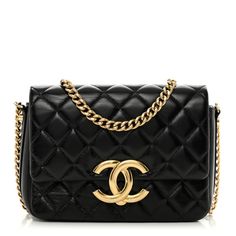 This is an authentic CHANEL Lambskin Quilted Mini Maxi CC Flap in Black. This shoulder bag is crafted of luxurious diamond quilted lambskin leather in black. The bag features a gold tone chain-link shoulder strap and a flap with a magnetic gold CC logo. The flap opens to a black fabric interior with a zipper pocket and leather card slots. Chanel Crossbody, Coco Handle, Chanel Tweed, Chanel Shoulder Bag, Chanel Caviar, Chanel Bags, Diamond Quilt, Cc Logo, Hand Bags