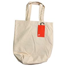 Nike Heritage Tote Bag (Blank) Natural / Tan Sku: Cw1120-120 100% Cotton Width: 16.25 Inches Length: 18 Inches Nike Tote Bag, Nike Tote Bags, Bag Nike, Nike Bags, Natural Tan, Womens Tote Bags, Natural Color, Bags Handbags, Nike Women