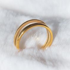 A gold-plated double ring inspired by simple geometric forms. It feels classic yet playful. Perfect as a friendship ring/wedding gift and easy to be stackable and versatile. DETAILS:☆ Crafted in Titanium Alloy and plated with 14k gold. Nickel free.☆ High Quality Ring that lasts its color and beauty over time.☆ Comes beautiful packaged, in our branded Jewelry Box. Gift Ready.☆ US size:  Inside diameter in ''· US 6:  (0.65'')· US 7:  (0.68'')· US 8:  (0.71'')Ring Size Tips: The best way to determi Matte Gold Open Ring Perfect As A Gift, Matte Gold Open Ring For Gift, Minimalist Double Band Stackable Rings As Gift, Adjustable Double Band Gold Rings, Gold Double Band Classic Midi Rings, Modern Adjustable Gold Stackable Rings, Classic Gold Double Band Midi Rings, Gold Stackable Double Band Midi Rings, Gold Double Band Stackable Midi Rings