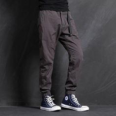 Love flaunting into casual events? Here is aesthetic UDEN casual cargo joggers crafted in four colors. A must-have in your casual pants collection, these regular fit cargo pants are styled from cotton and polyester that makes them perfect for your daily use, thus being durable and fashionable at the same time. Featuring quality materials, these pants are comfortable to wear and easy to maintain. Gender: Men's Style: Casual Fabric: Cotton, Polyester Fit Type: Regular Fit Bottoms Type: Pants . SIZ Techwear Cotton Joggers For Streetwear, Urban Cotton Cargo Jeans With Elastic Waistband, Baggy Cotton Techwear Joggers, Cotton Techwear Sweatpants For Outdoor, Casual Cotton Parachute Pants For Outdoor, Casual Cargo Pants With Elastic Waistband And Cuffed Ankles, Techwear Style Tapered Leg Cotton Sweatpants, Techwear Cotton Sweatpants With Tapered Leg, Cotton Techwear Parachute Pants With Tapered Leg