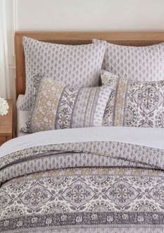 the comforter is neatly made and ready to be used in this bedding set