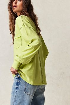 Just as effortless as it is essential, this timeless tee is featured in a staple, long sleeve silhouette with distressed seaming throughout for a true lived-in look. **Fit:** Slouchy, relaxed fit **Features:** Scoop neckline, front bust patch pocket, dropped shoulders **Why We | We The Free Fade Into You Tee at Free People in Green, Size: XS Everyday Fall Tops, Spring Tops With Frayed Hem For Casual Gatherings, Trendy Tops With Contrast Stitching For Spring, Fall Washed Tops For Casual Gatherings, Trendy Long Sleeve Washed Top, Long Sleeve Washed Tops For Everyday, Everyday Long Sleeve Washed Tops, Everyday Washed Long Sleeve Tops, Casual Tops With Contrast Stitching For Fall