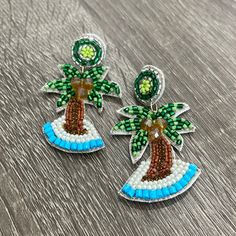 Get ready for Spring Break and Summer in these fun and beautiful earrings. Handmade Seed Beaded Palm Tree Dangle Earrings Fun Beaded Dangle Earrings For Beach, Holiday Dangle Beaded Earrings, Colorful Beaded Dangle Earrings, Fun Beaded Earrings For Beach, Beaded Dangle Chandelier Earrings For Beach, Fun Beaded Earrings For The Beach, Green Beaded Fun Earrings, Fun Dangle Beaded Earrings With Ear Wire, Colorful Bead Drop Earrings For Vacation