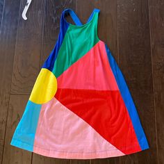 Never Worn Has And Criss Cross Back Colorful Playful Sleeveless Dress, Colorful Sleeveless Playful Dress, Multicolor Sleeveless Sundress For Playtime, Multicolor Sleeveless Sundress For Playdate, Multicolor Sundress For Summer Play, Multicolor Summer Sundress For Play, Fun Multicolor Sundress For Playtime, Multicolor Summer Sundress For Playtime, Multicolor Sleeveless Sundress For Play