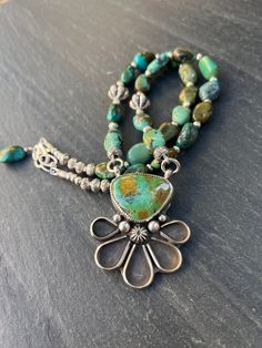 "Luxurious Boho at its best!!  This necklace features a stunning Sterling and Bamboo Mountain Turquoise pendant, made by a talented silversmith in Texas.  Check out all the silver and check out that stone!!  Truly One of a Kind. The necklace is comprised of nuggets of genuine Hubei Turquoise with gorgeous greens and blues and mottling, carefully selected to echo all the colors in the pendant.  Two Hill Tribes flowered pumpkin beads accent the strand, and all spacers in Hill Tribes Fine Silver al Silver Sterling Jewelry, List Date, Pumpkin Beads, Hubei Turquoise, Pumpkin Bead, Pumpkin Flower, Southwest Jewelry, Necklace Turquoise, Sterling Jewelry