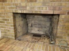 a brick fireplace is shown with the door open and bricks on it's sides