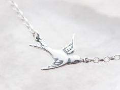 "Sterling silver Bird join to sterling silver chain Necklace; chic Solitaire Bird Necklace. This lovely necklace is decorated with a simply sweet bird, Is a popular trend and cool simple thing to stand out in the crow. Great gift for birthday, Mothers, bridesmaids, anniversary, best friends Se More Great Flying Bird Designs☛ http://etsy.me/13RfLvc This listing is for the first pic. Features: ~ Sterling silver bird. 92.5 stamped at the back. ~ 925 Sterling Silver Italian Chains. Select your lengt Sterling Silver Bird Necklace, Silver Bird-shaped Sterling Silver Necklace, Bird Sparrow, Bird Designs, Silver Bird, Flying Bird, Bird Necklace, Sterling Silver Chain Necklace, Lovely Necklace