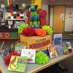 there is a display in the library with books and decorations on it for children's birthdays