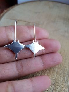 Stingray Earrings, Manta Ray Earrings, Sterling Silver Stingray, Stingray Jewellery, Nautical Earrings A lovely handmade stingray dangle earrings in sterling silver.  The manta ray is approximately 2 cm in size with 1 mm thick.  Total length of this earrings is approximately 3.5 cm. All jewellery will come in a lovely packaging. Similar item. https://www.etsy.com/uk/shop/flowerpecker?ref=seller-platform-mcnav&section_id=21859112 Gray Dangle Jewelry For Gifts, Gray Dangle Jewelry With Matching Earrings, Sterling Silver Gray Dangle Jewelry, Gray Sterling Silver Dangle Jewelry, Gray Ear Wire Earrings For Gift, Gray Drop Earrings For Pierced Ears, Gray Jewelry For Pierced Ears As A Gift, Gray Drop Earrings For Gift, Gray Dangle Earrings With Ear Wire