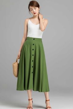 "This wonderfully retro button down Linen skirt is going to take you from the desk to dinner out and errands... Dressy and comfortable, The green Skirt offers a classic look that never goes out of style. DETAIL * Get 20 USD off over two color selection with the skirt (Code : TWOPIECESCYM) * 50% linen, 50% cotton * No lining * Seam pocket * Right side zipper closure, can't open buttons * Button down Linen skirt * Below Knee Length * A Line skirt, Midi skirt * Wash by hand or machine with cold wat Long Wool Skirt, Dark Grey Skirt, Long Linen Skirt, Skirts Flowy, Skirt Linen, Skirt A Line, Tailored Clothes, Handmade Skirts, Women Skirt