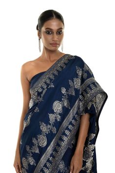 Elevate your style with our Blue Floral Printed Art Silk handwoven saree featuring allover stone embroidery work. This saree exudes elegance, ideal for family gatherings or formal events. Experience timeless beauty that will be a wardrobe treasure for years to come. Elegant Pre-draped Saree With Motifs For Navratri, Elegant Pre-draped Saree With Motifs For Festivals, Festive Pre-draped Jamawar Saree With Motifs, Festive Jamawar Pre-draped Saree With Motifs, Elegant Jamawar Pre-draped Saree For Eid, Elegant Pre-draped Jamawar Saree With Pallu, Traditional Pre-draped Saree For Eid Reception, Anarkali Jamawar Blouse With Traditional Drape, Elegant Embroidered Katan Silk Blouse Piece