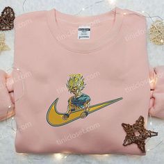 Introducing the Goku Angel x Nike Embroidered Shirt, a must-have for all Dragon Ball enthusiasts! This custom shirt combines the iconic Nike logo with intricate Goku Angel embroidery, creating a unique fusion of style and fandom. Crafted with precision, this shirt boasts high-quality materials that ensure comfort and durability. With its eye-catching design, this shirt is perfect for casual outings or showing off your love for Dragon Ball. Stand out from the crowd and embrace your inner Super Sa Rapunzel Cartoon, Nike Cartoon, Nike Inspired, Best Family Gifts, Maroon Hoodie, Obito Uchiha, Embroidered Shirts, Tyler Durden, Anime Sweatshirt