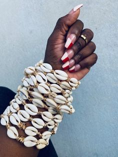 Hey, I found this really awesome Etsy listing at https://www.etsy.com/listing/977419530/forever-jackie-cowrie-bangles Bohemian Gold Beaded Bracelets With Shell, Bohemian Gold Beaded Shell Bracelets, Shell Bangles, Afro Jewelry, Dope Jewelry Accessories, Cowry Shell, Cowrie Shells, Dope Jewelry, African Jewelry